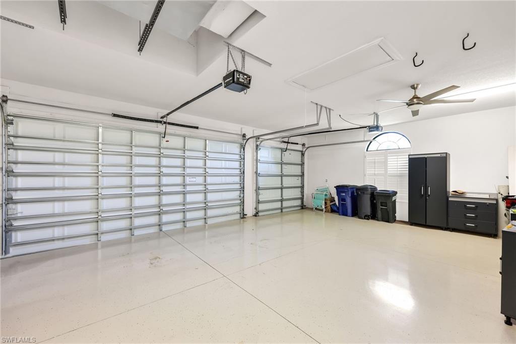 Garage featuring a garage door opener