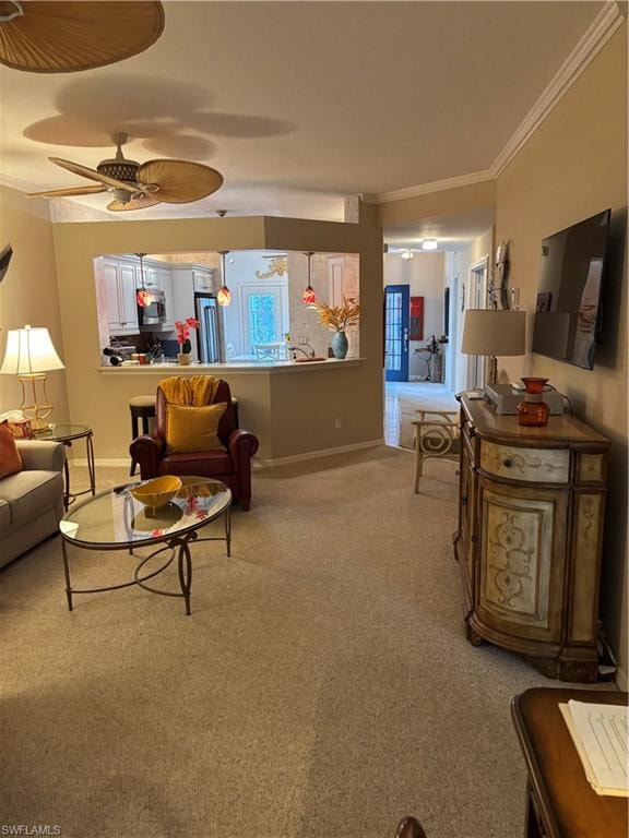 Living room featuring light colored carpet, ornamental molding, and a ceiling fan