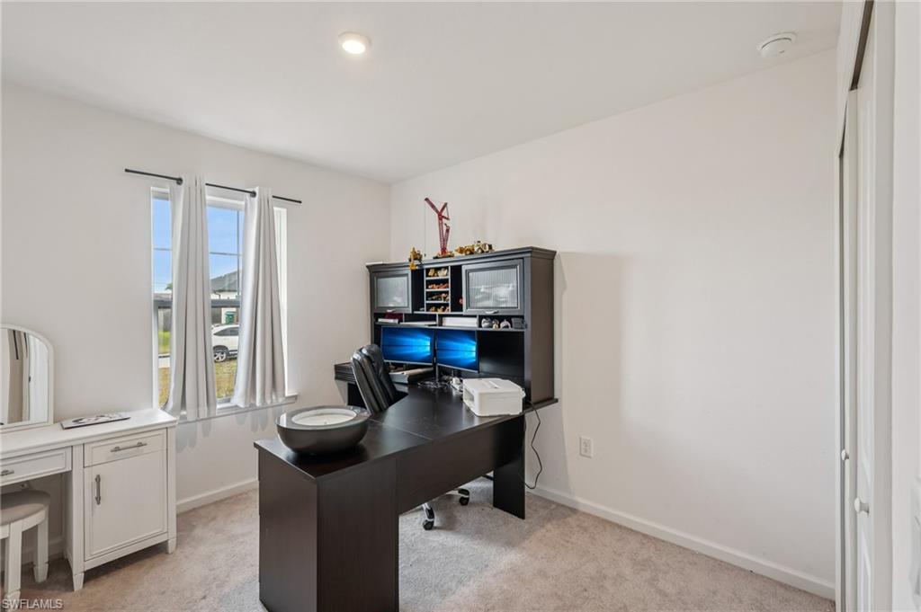 Office with light colored carpet