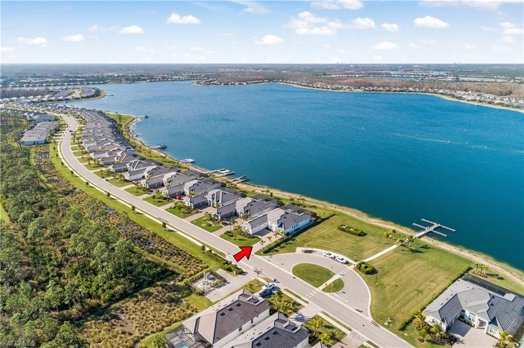 Aerial perspective of suburban area with a nearby body of water