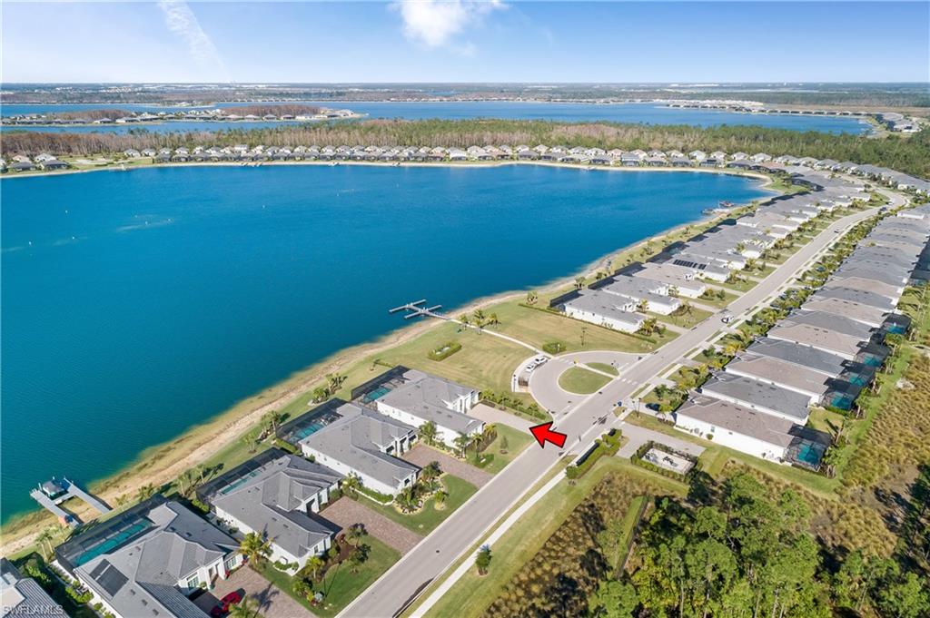 View of property location with nearby suburban area and a nearby body of water