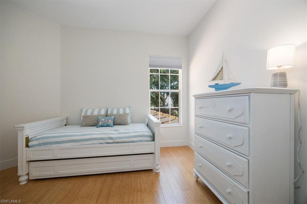 Bedroom with light hardwood / wood-style floors