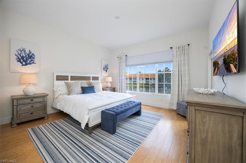 Bedroom with light hardwood / wood-style flooring