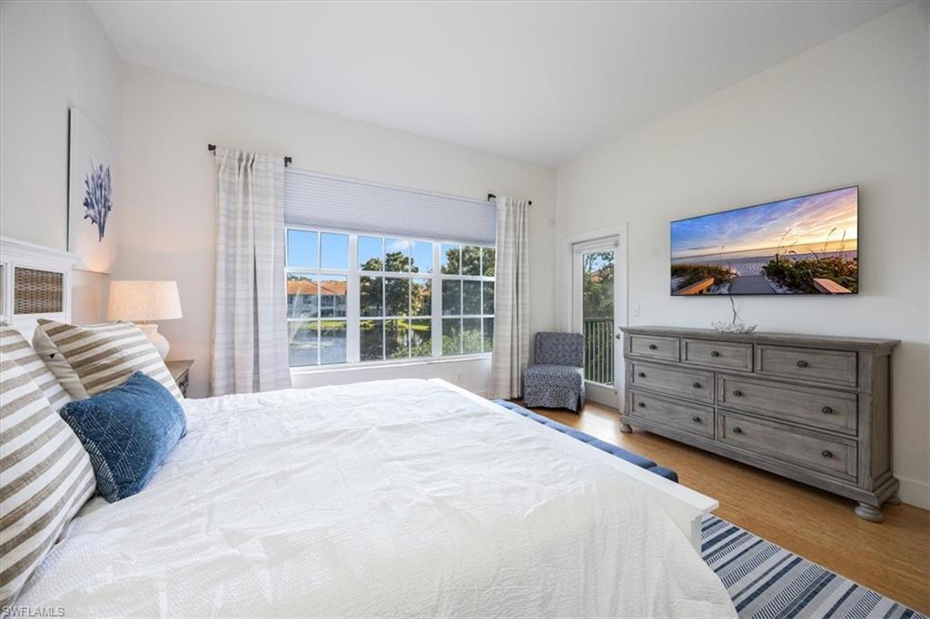 Bedroom featuring light hardwood / wood-style flooring and multiple windows