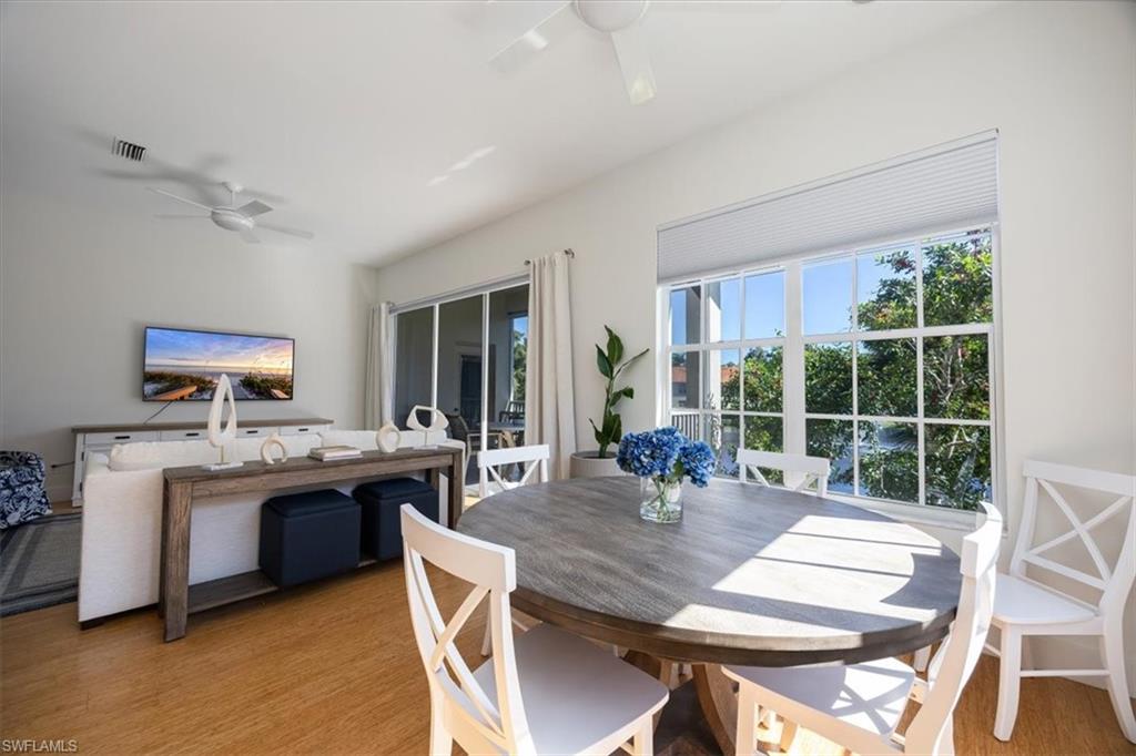 Dining room with light wood-type flooring and ceiling fan