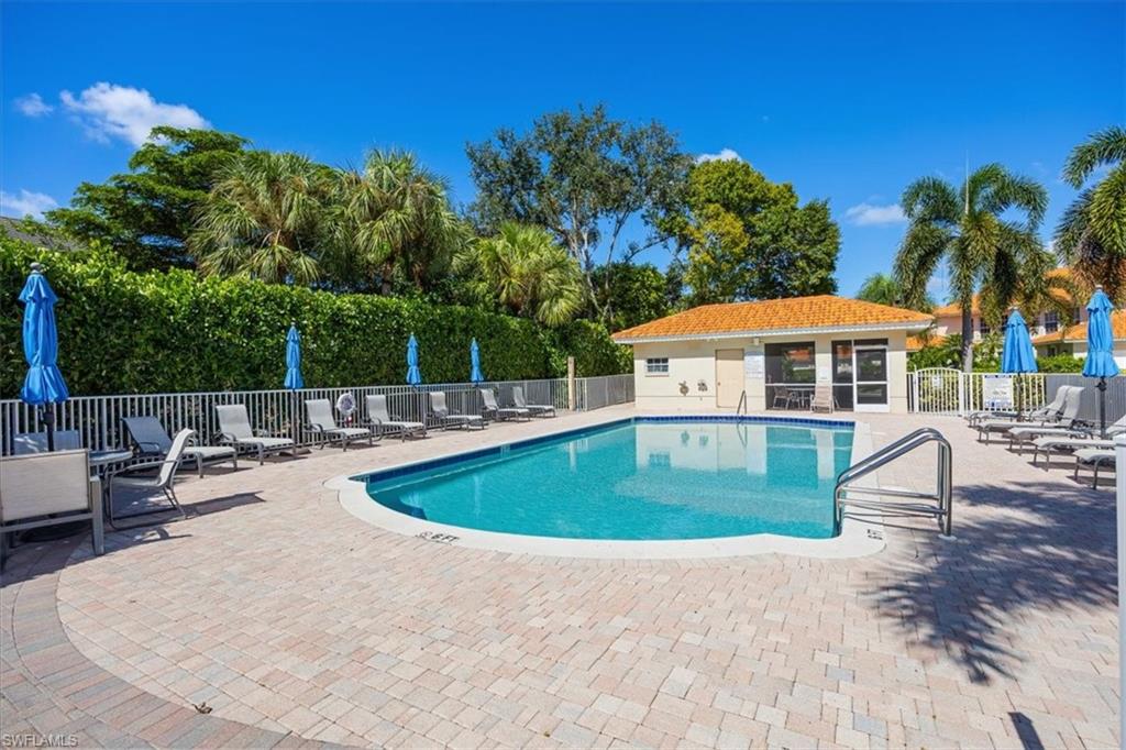 View of swimming pool with a patio area