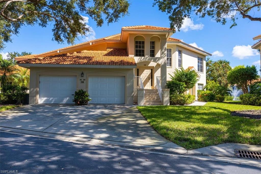 Mediterranean / spanish-style house with a front lawn