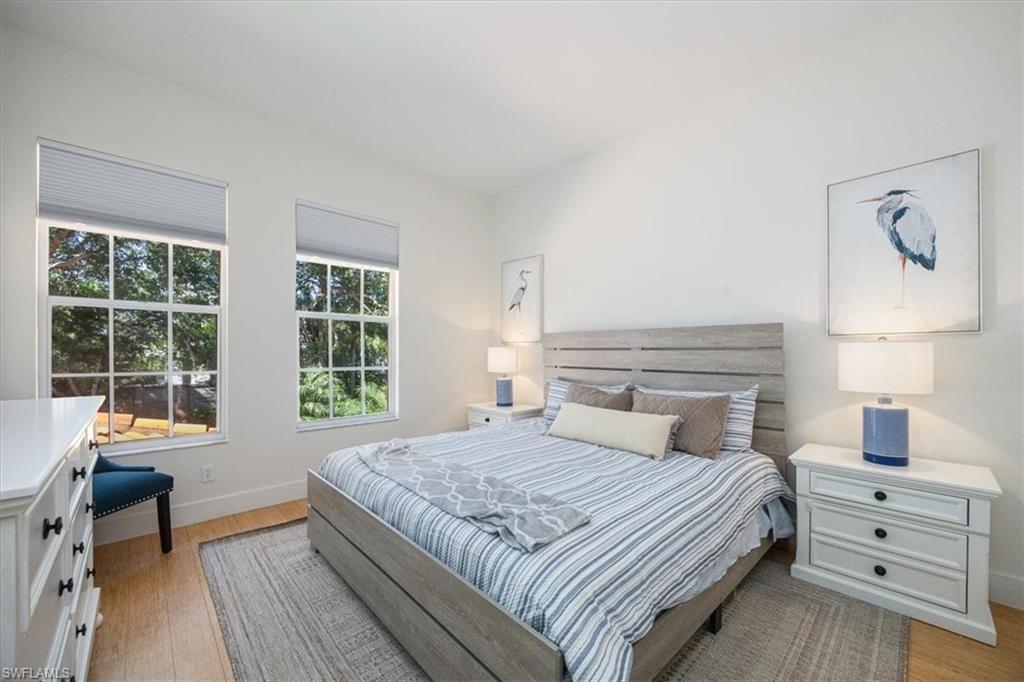 Bedroom with light hardwood / wood-style floors
