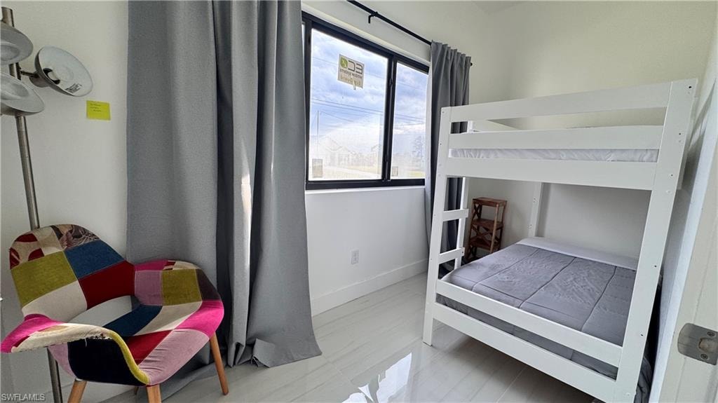 Bedroom featuring baseboards
