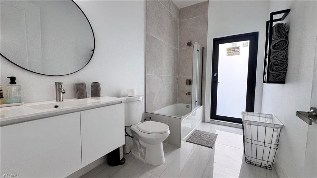 Full bathroom featuring vanity and bathing tub / shower combination