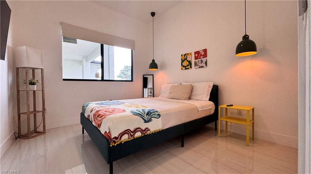 Bedroom featuring baseboards