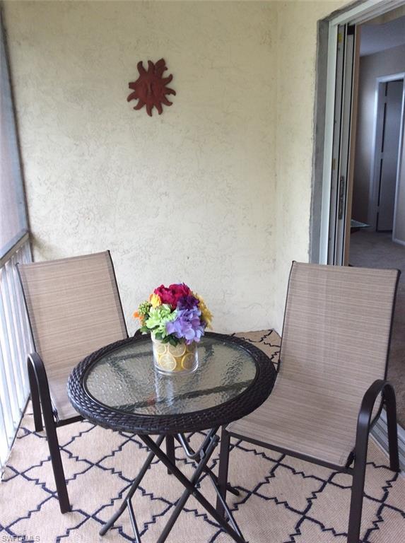 Screened lanai overlooking landscape area