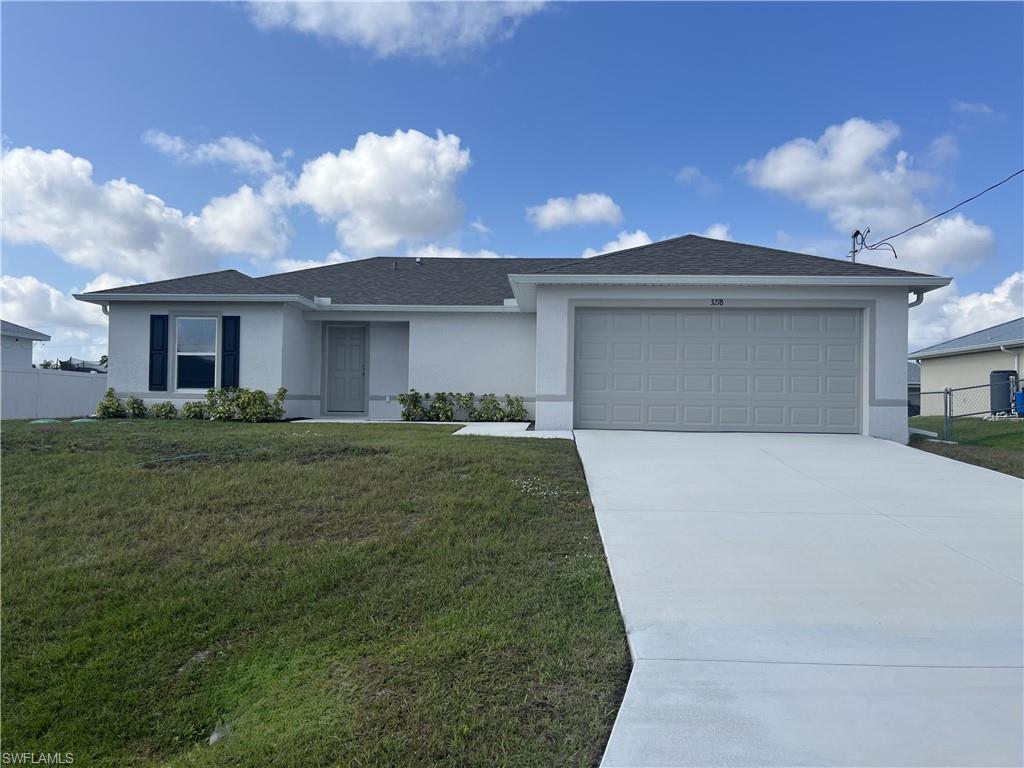 Single story home featuring stucco siding, driveway, roof with shingles, and an attached garage