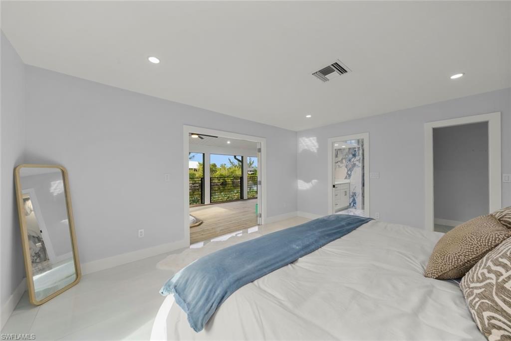 Bedroom with recessed lighting and connected bathroom
