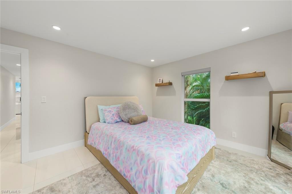Bedroom featuring recessed lighting and tile patterned floors
