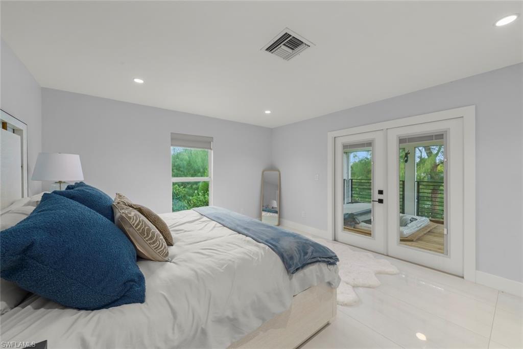 Bedroom featuring french doors, recessed lighting, access to exterior, and tile patterned floors