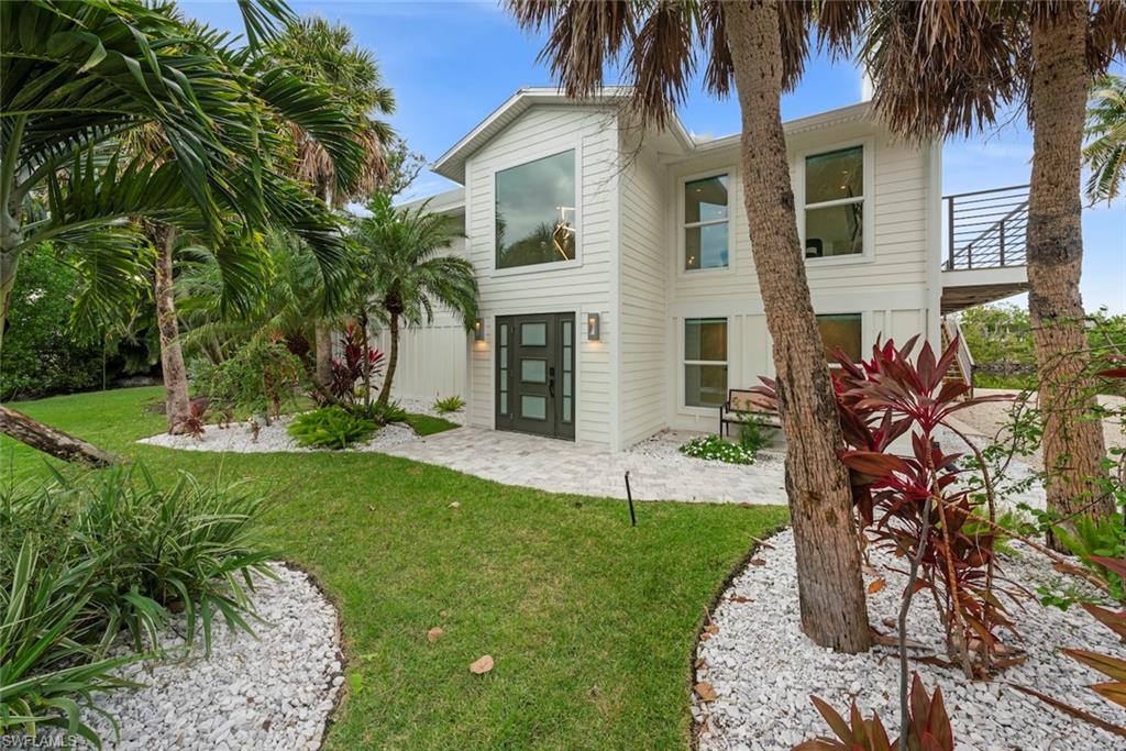 Back of house featuring a yard and a patio area