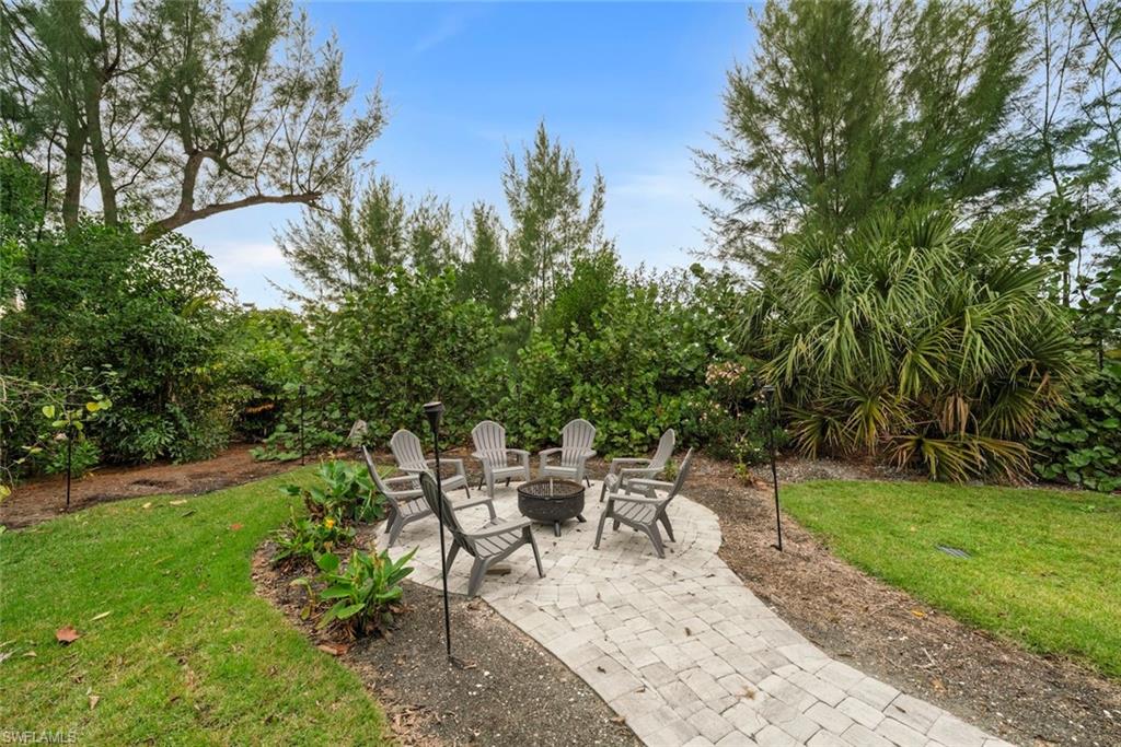 View of patio with a fire pit