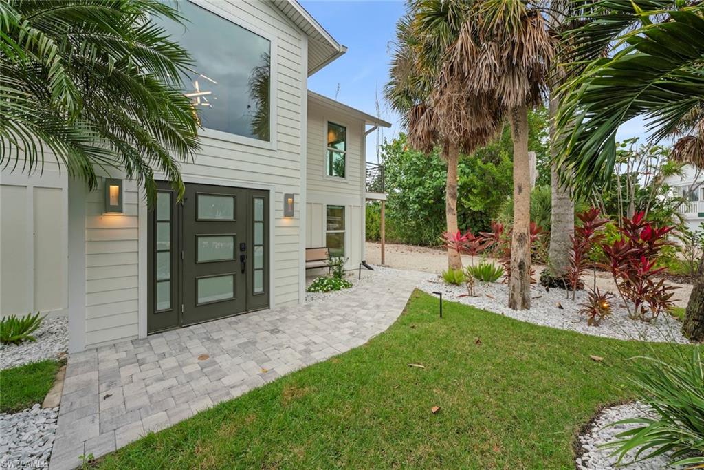View of green lawn featuring a patio area
