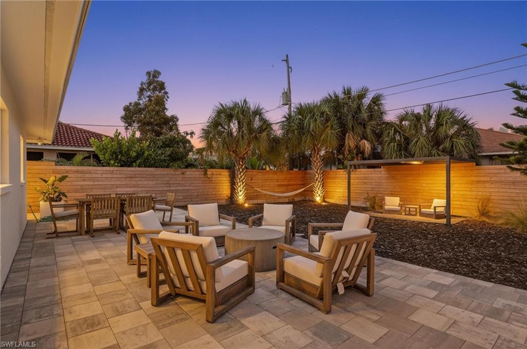 Fenced backyard with a patio, outdoor lounge area, and outdoor dining area