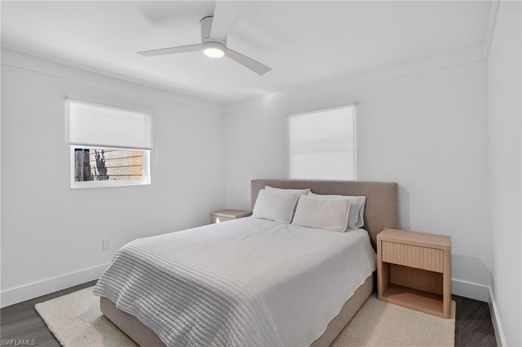 Bedroom with ceiling fan and wood finished floors
