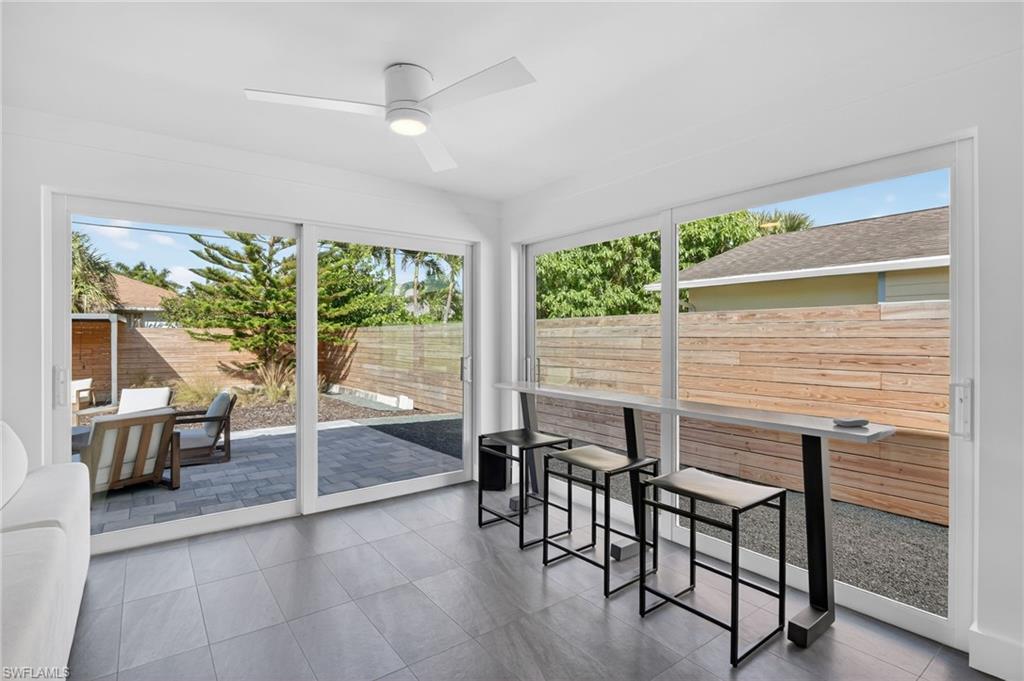 Sunroom / solarium featuring healthy amount of natural light