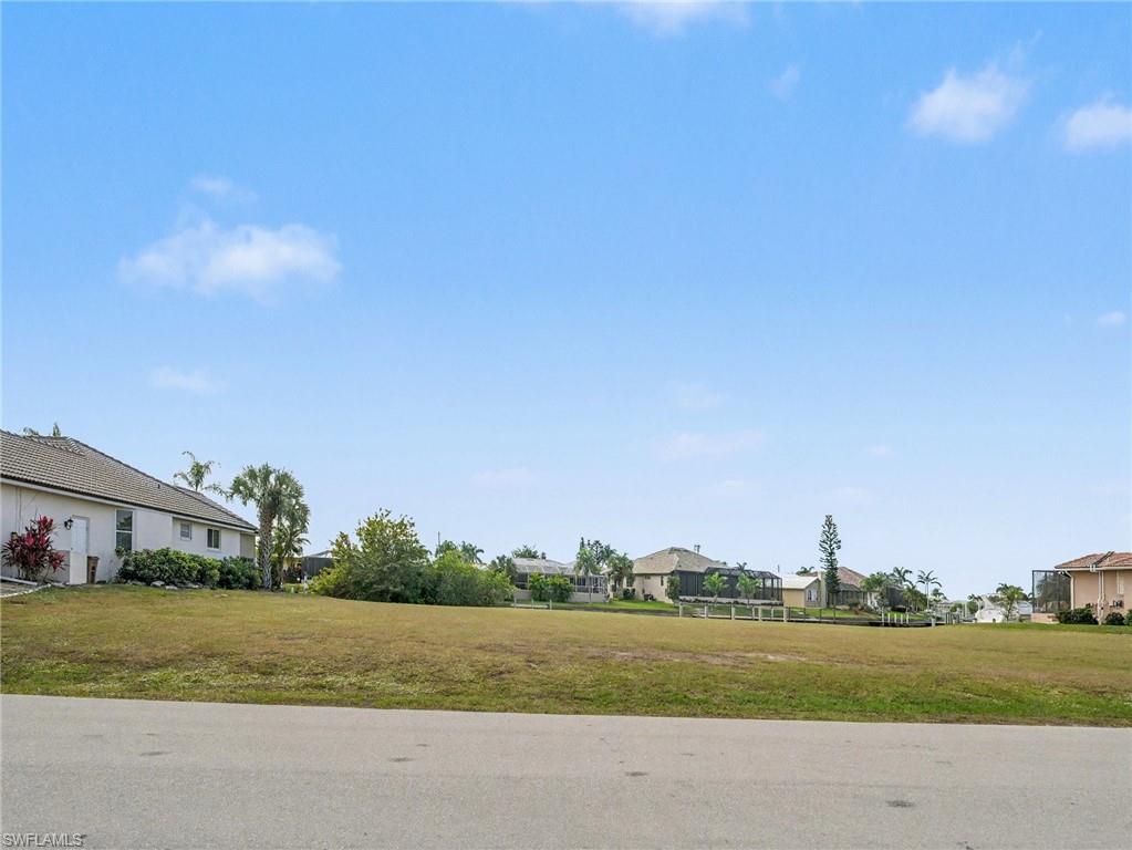 View of asphalt street featuring a residential view