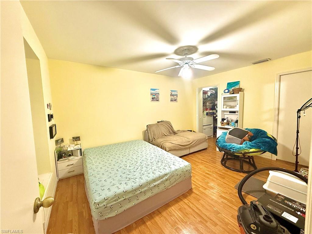 Bedroom with light wood-type flooring and ceiling fan