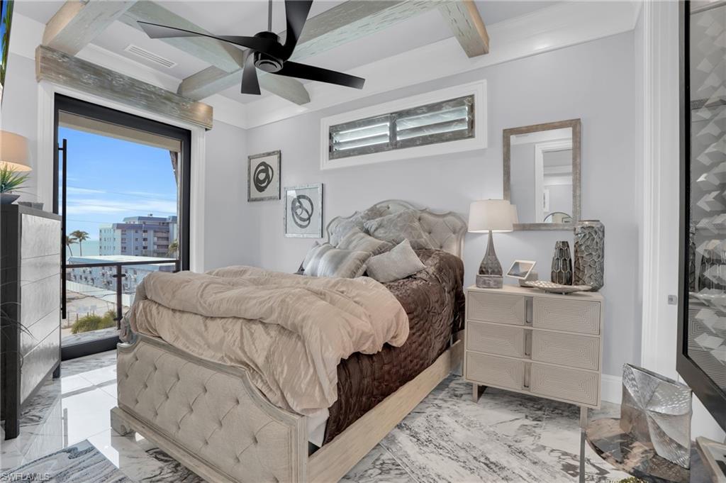 Bedroom with marble look tile flooring, a ceiling fan, beamed ceiling, coffered ceiling, and access to exterior - Virtually Edited Image