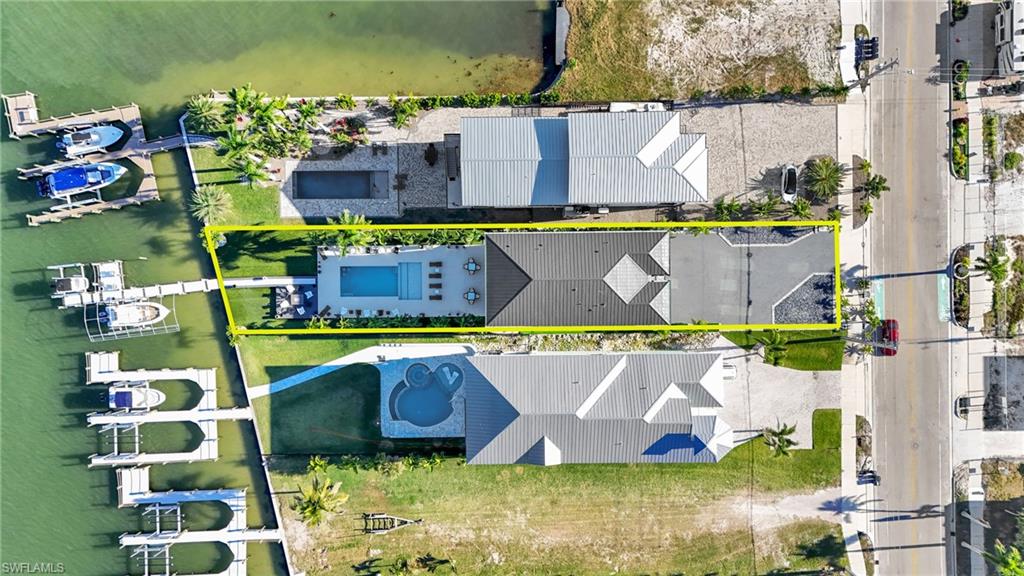Aerial view of property's location with property parcel outlined - Virtually Edited Image