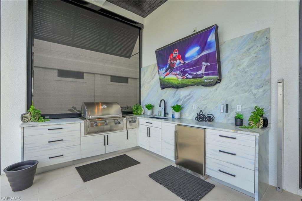 View of patio / terrace with a sink and area for grilling - Virtually Edited Image