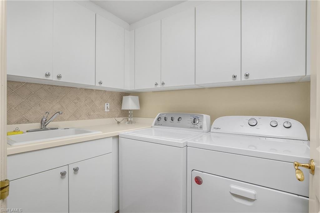 Laundry with sink and ample storage cabinets