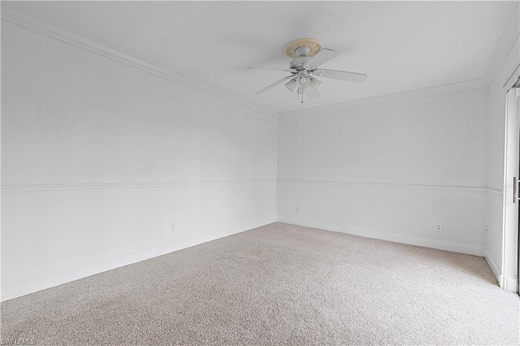 Unfurnished room with crown molding and ceiling fan
