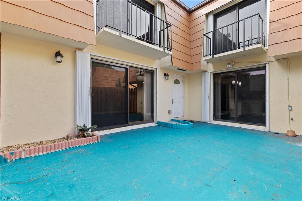 View of swimming pool with a balcony and a patio area