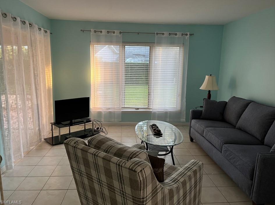 Living room featuring light tile patterned flooring