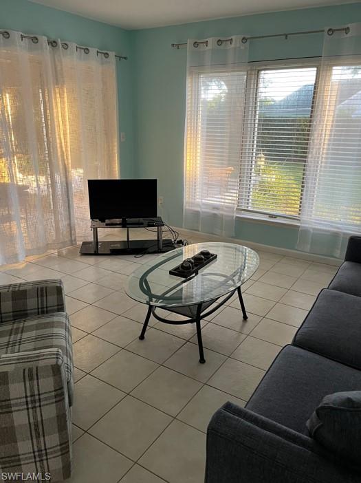 Living room with light tile patterned floors