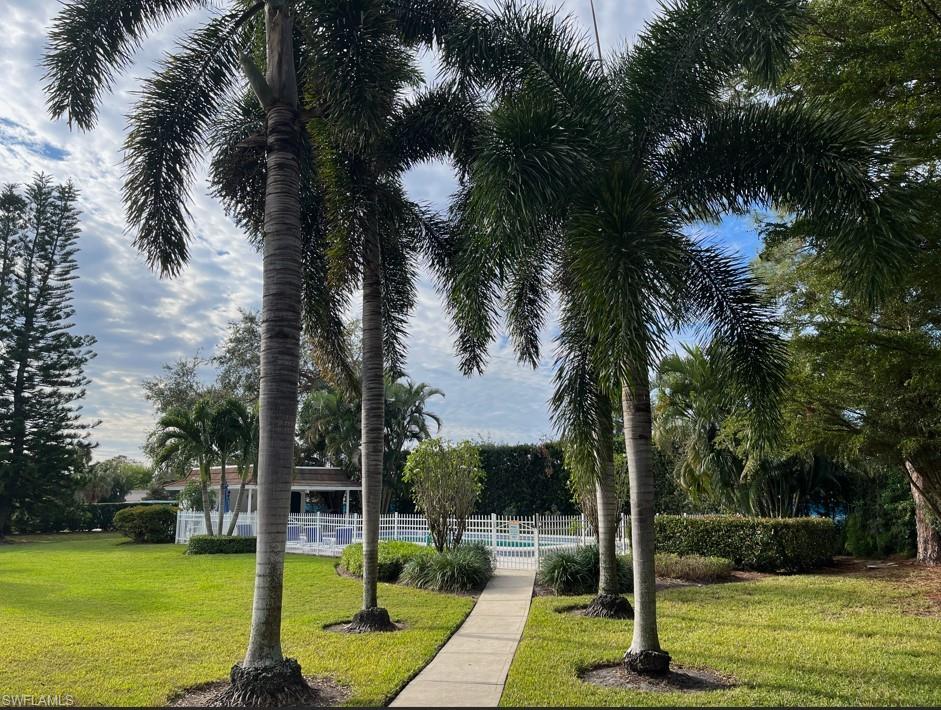 Surrounding community featuring a lawn