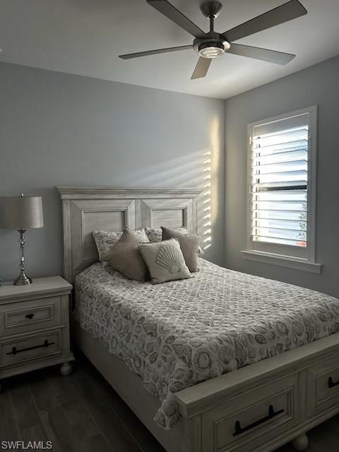 Bedroom featuring wood finish floors and a ceiling fan