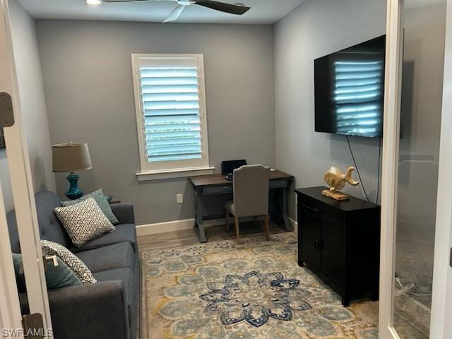 Office space featuring light wood-style flooring and ceiling fan