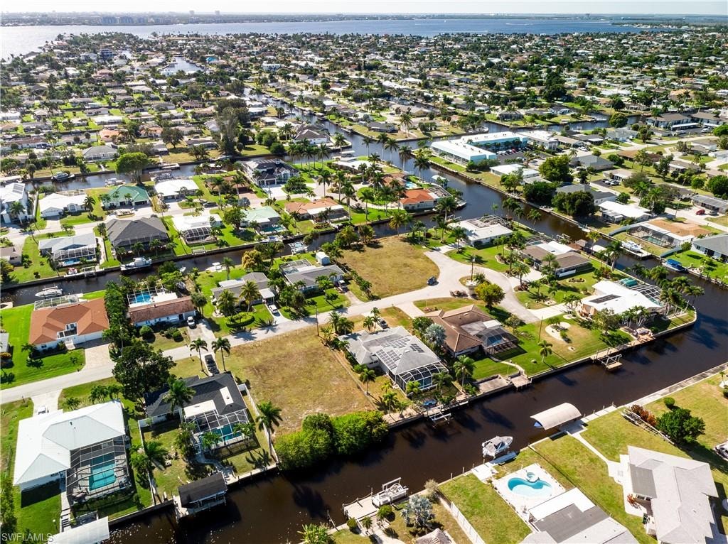 View of property location with nearby suburban area and a large body of water
