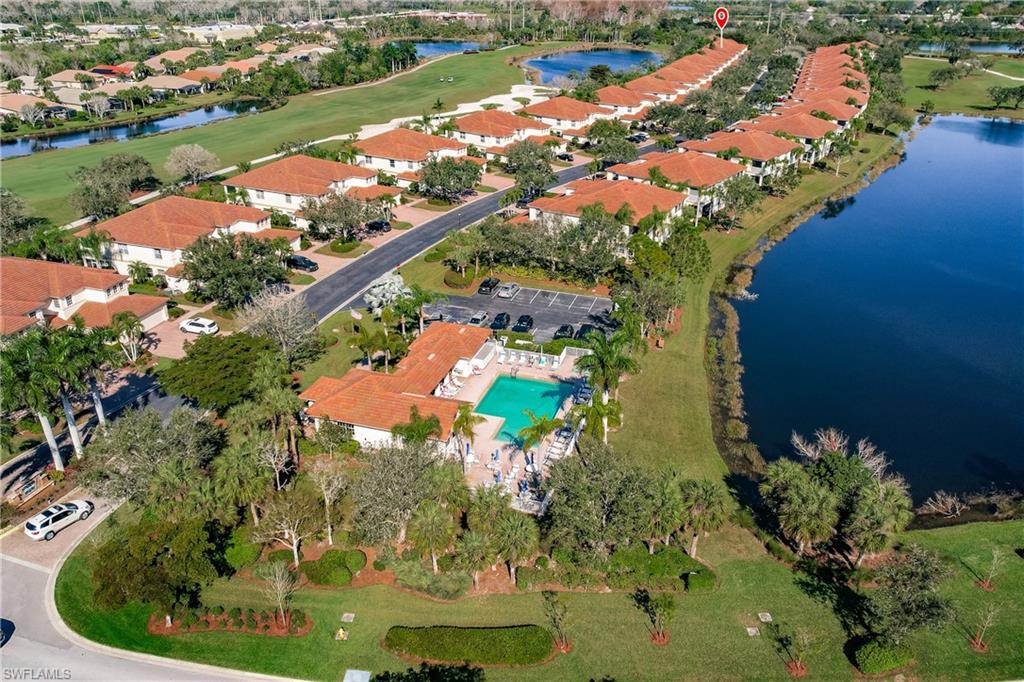 Aerial overview of property's location with a nearby body of water and nearby suburban area
