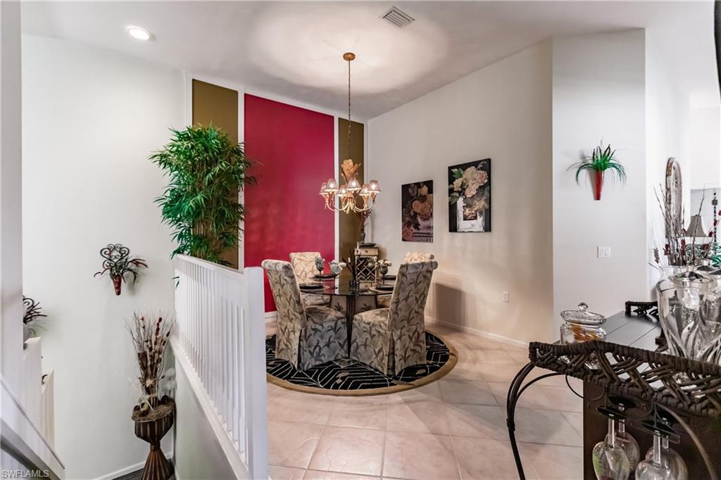 Dining room featuring a chandelier and light tile patterned floors