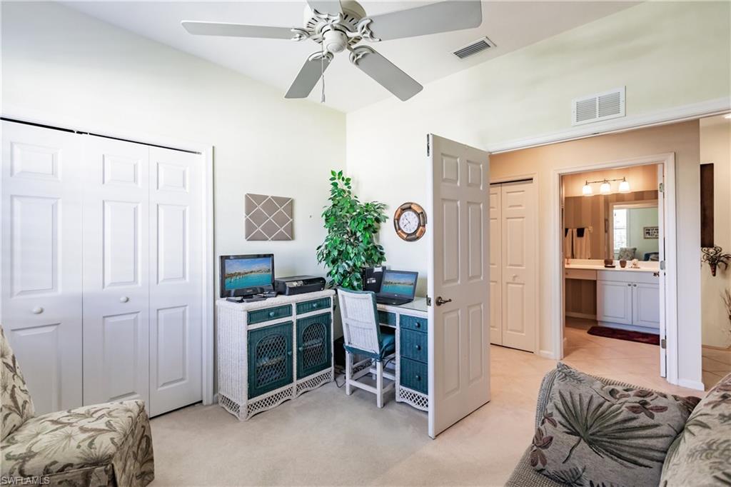 Office featuring light colored carpet and ceiling fan