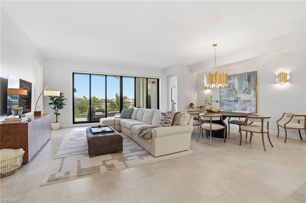 Living room featuring a chandelier and light tile patterned floors