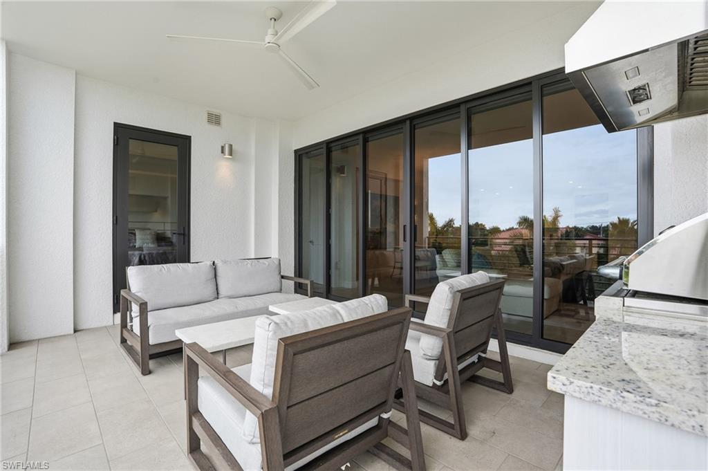 View of patio / terrace featuring a ceiling fan, an outdoor hangout area, and grilling area
