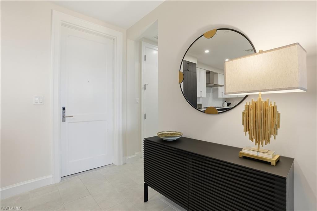 Hallway with baseboards and recessed lighting