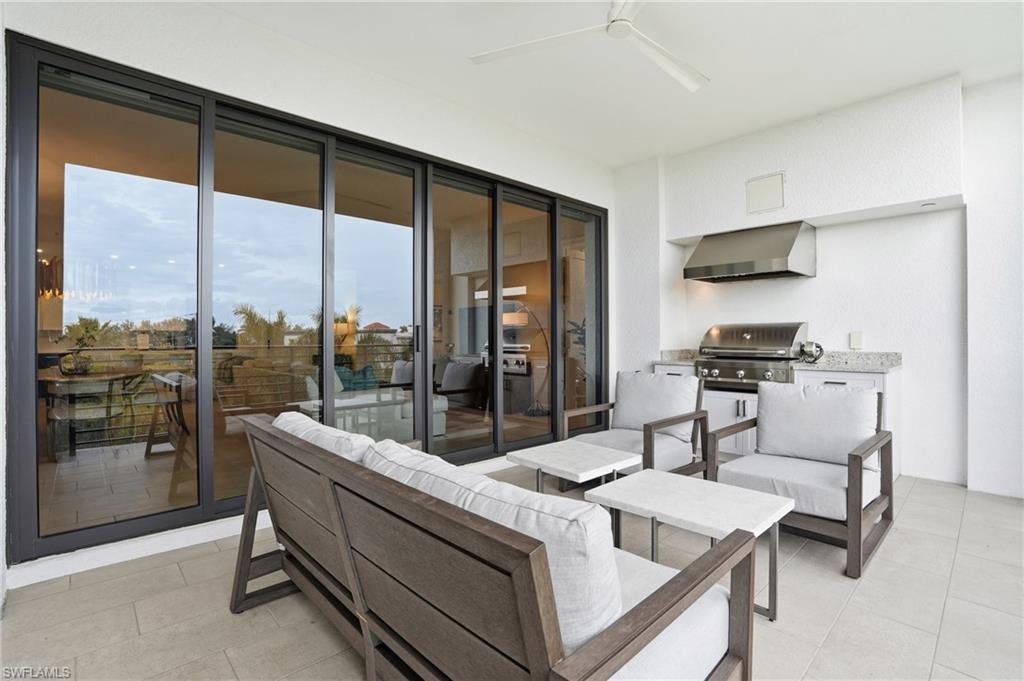 View of patio / terrace with ceiling fan, an outdoor hangout area, and a grill