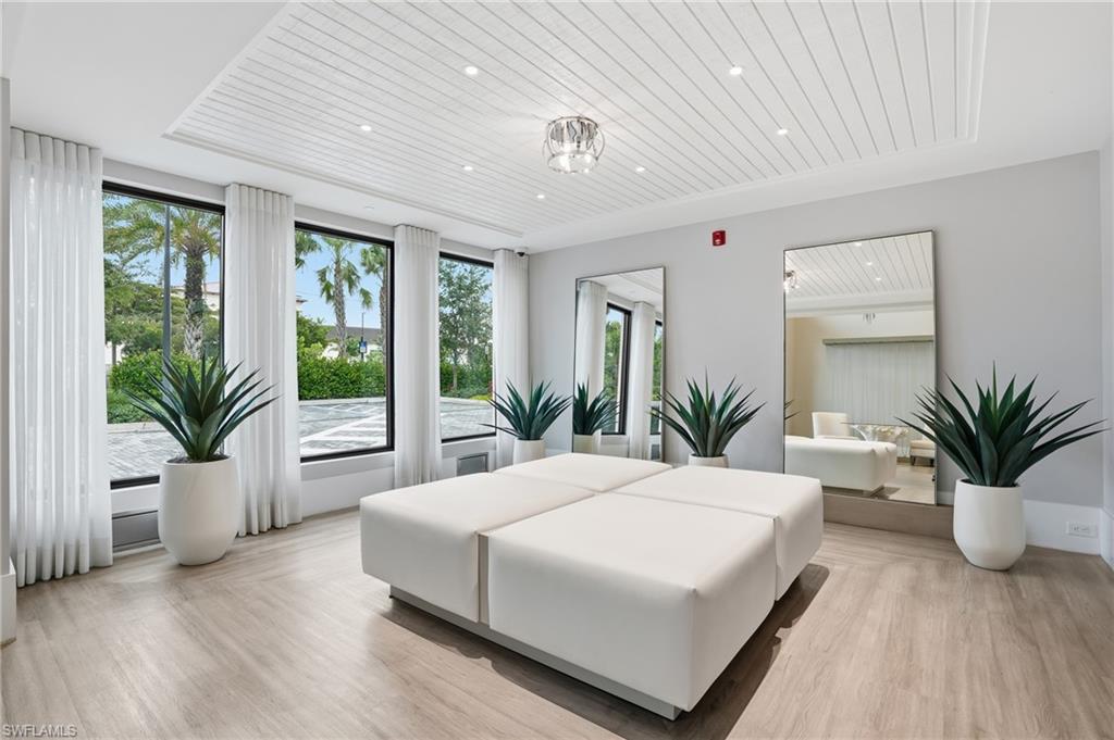 Bedroom with wood ceiling, light wood-style floors, and recessed lighting