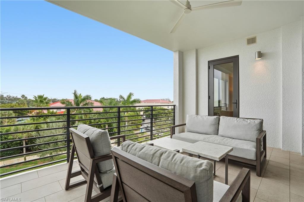 Balcony featuring a ceiling fan and outdoor lounge area