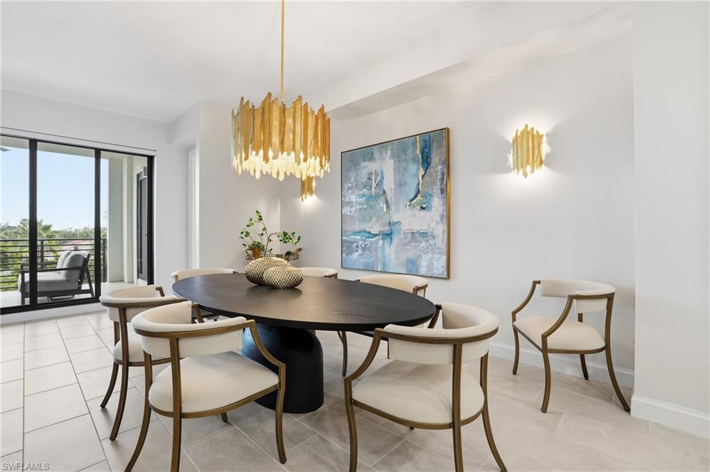 Dining room featuring baseboards and light tile patterned floors